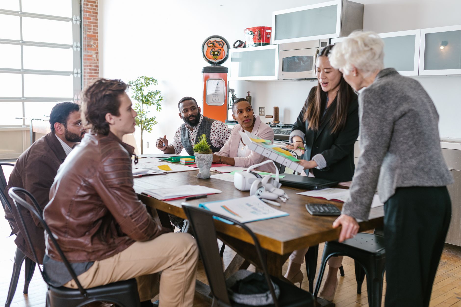 Financial technology professionals reviewing data at a modern office desk