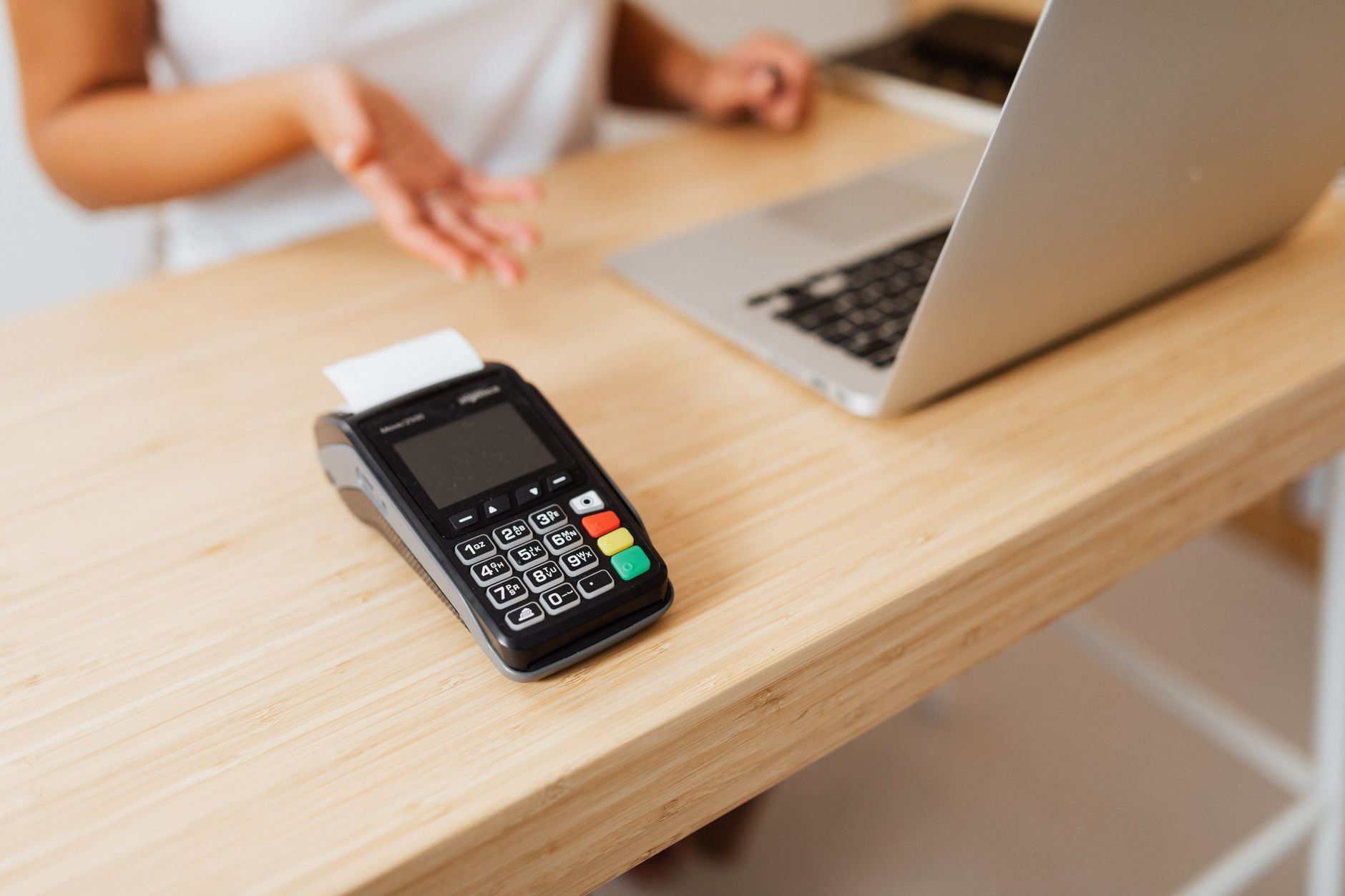 Business owner reviewing payment transaction data on a laptop screen