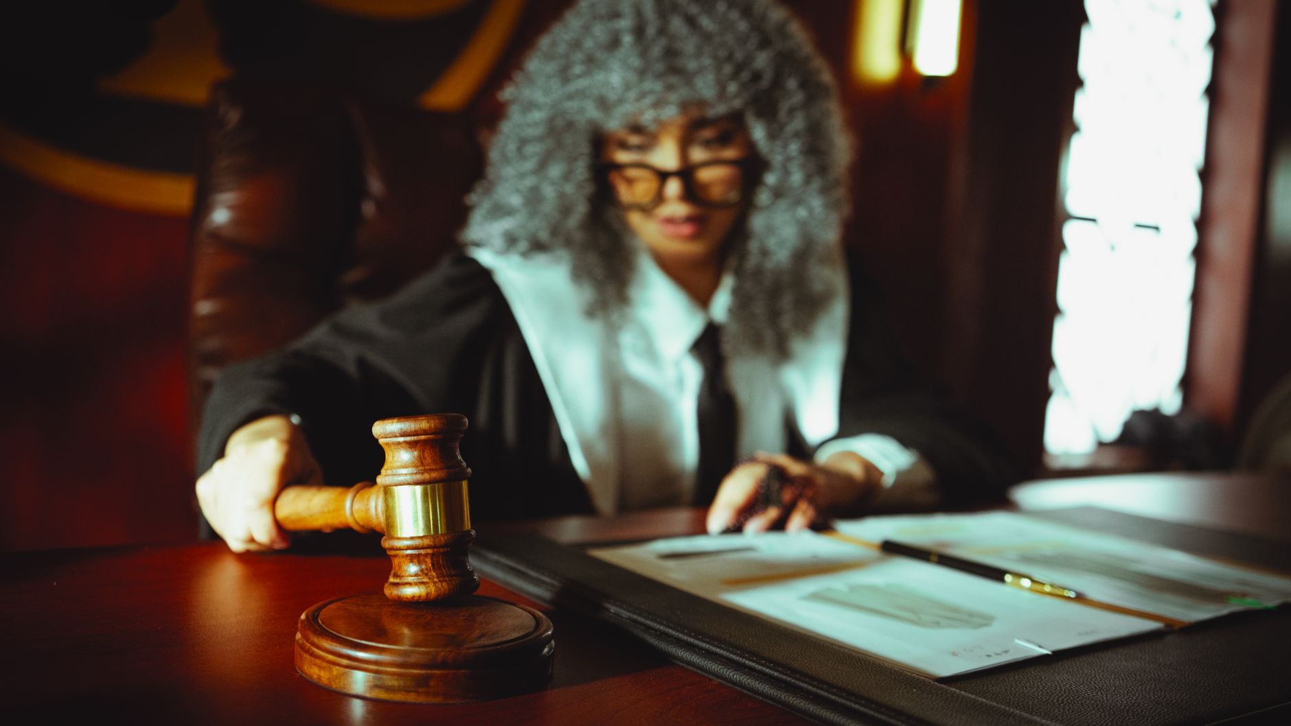 Legal documents and papers arranged on a courtroom table representing antitrust proceedings