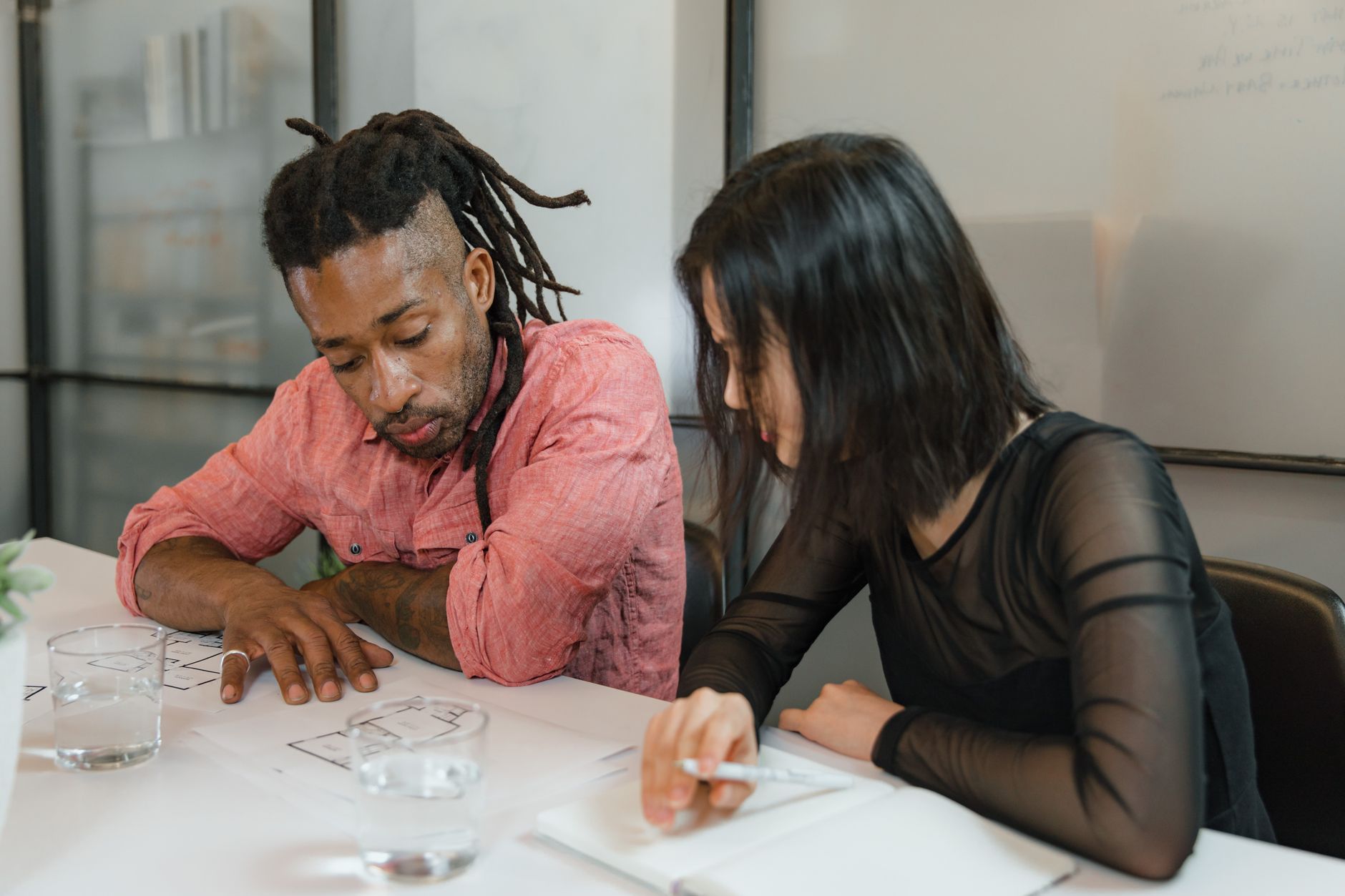 Executives discussing financial strategy around a conference table