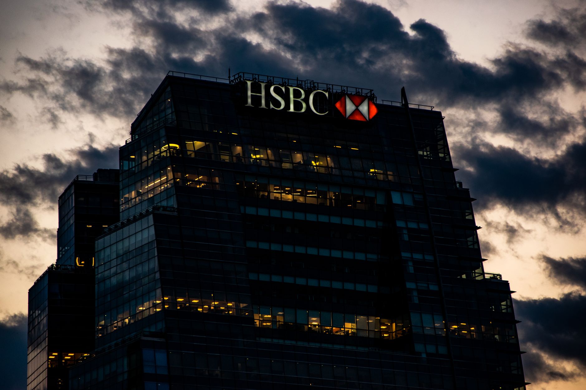 Exterior view of a major international bank headquarters building in an urban financial district