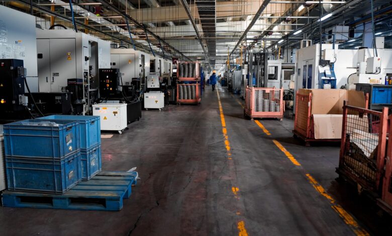 Workers assembling smartphones on a modern factory production line