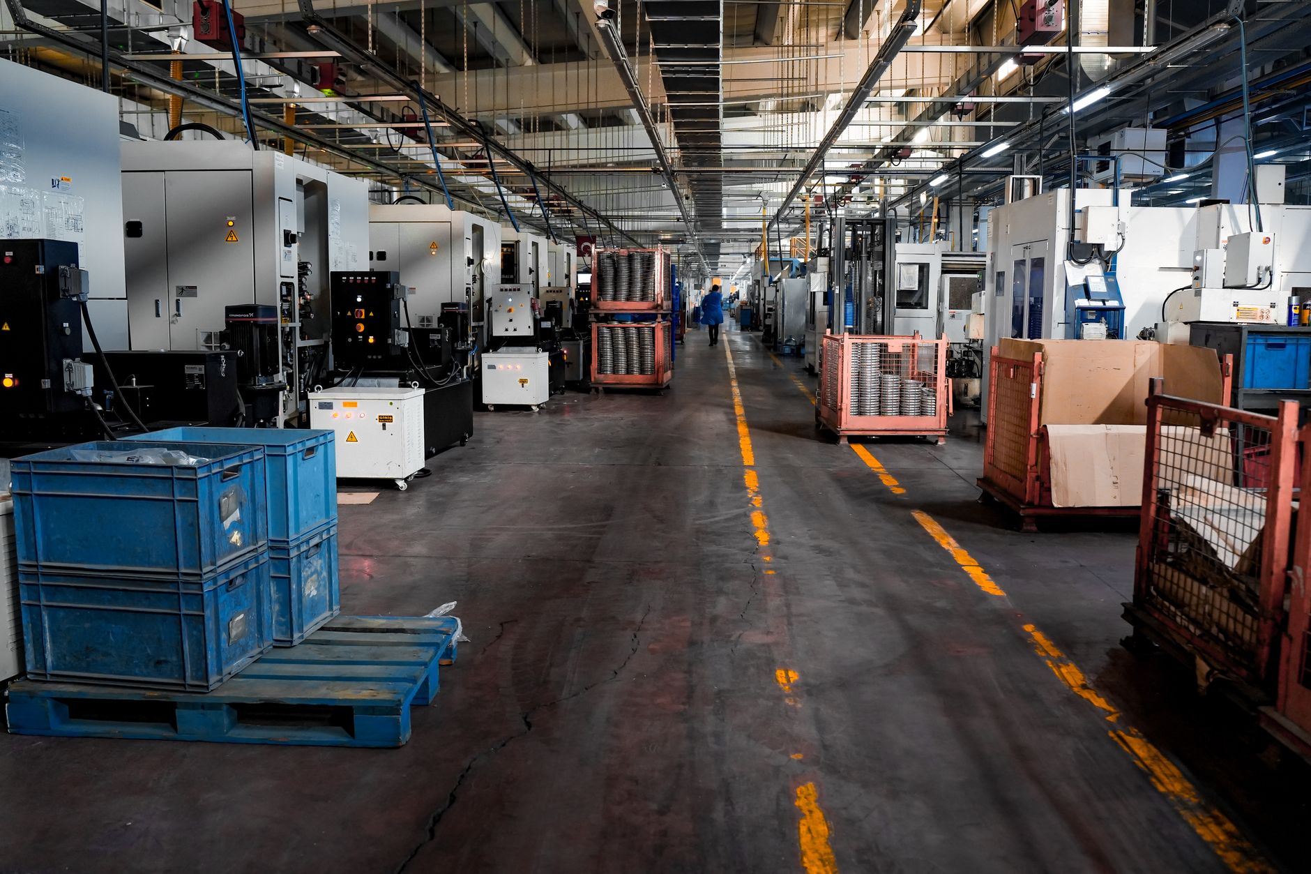 Workers assembling smartphones on a modern factory production line