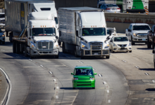 A self-driving vehicle traveling on an urban road representing the rise of robotaxi services