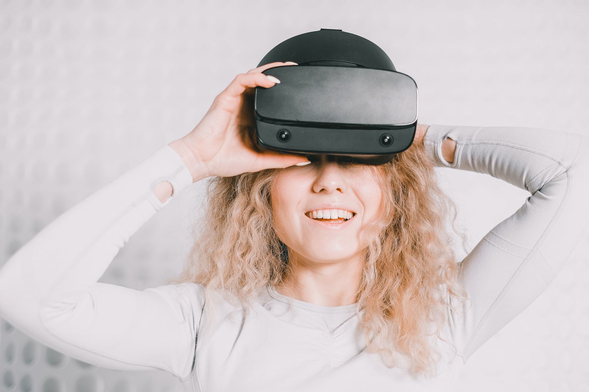 Person wearing a virtual reality headset in a modern indoor setting