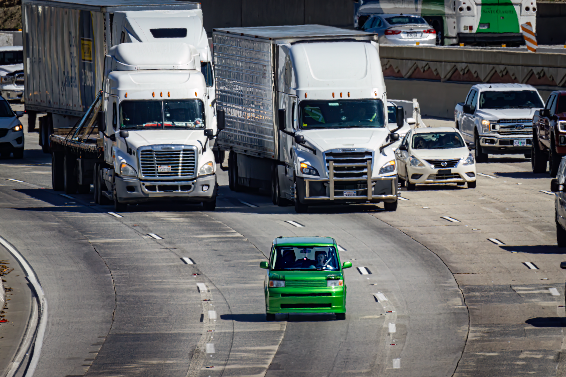 A self-driving vehicle traveling on an urban road representing the rise of robotaxi services