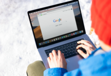 Person using a laptop to perform an AI-powered search query