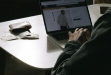 Person browsing an online store on a laptop, representing e-commerce platform competition