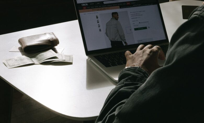 Person browsing an online store on a laptop, representing e-commerce platform competition