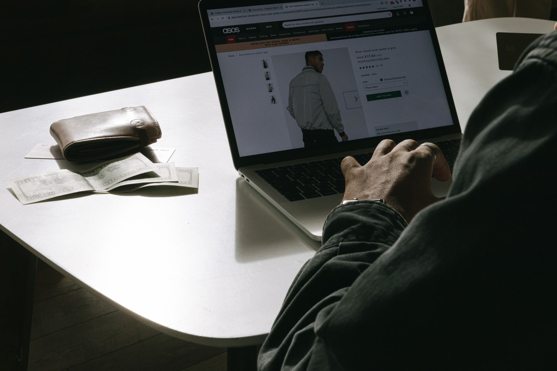 Person browsing an online store on a laptop, representing e-commerce platform competition