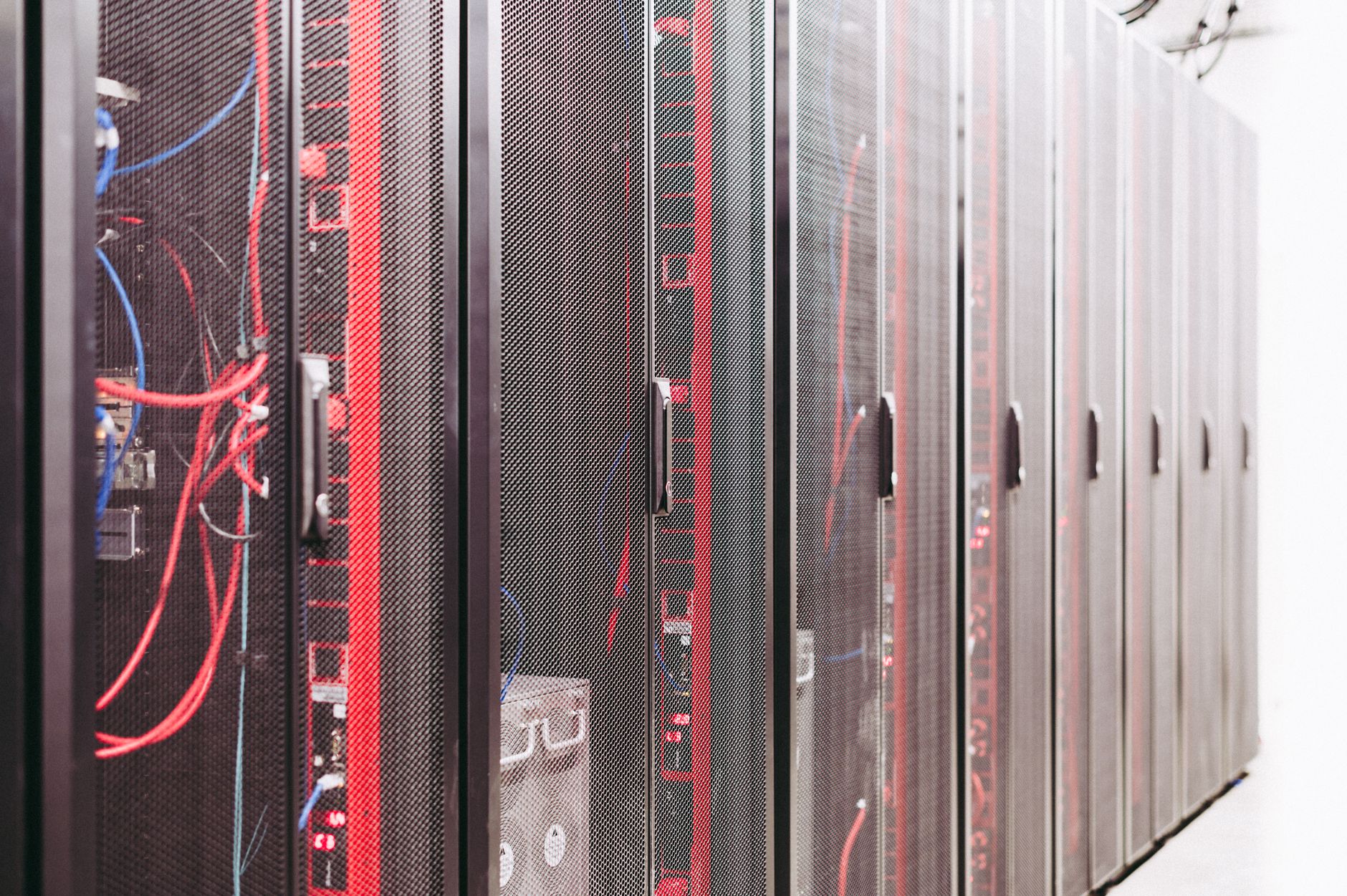 Rows of servers inside a modern enterprise data center facility