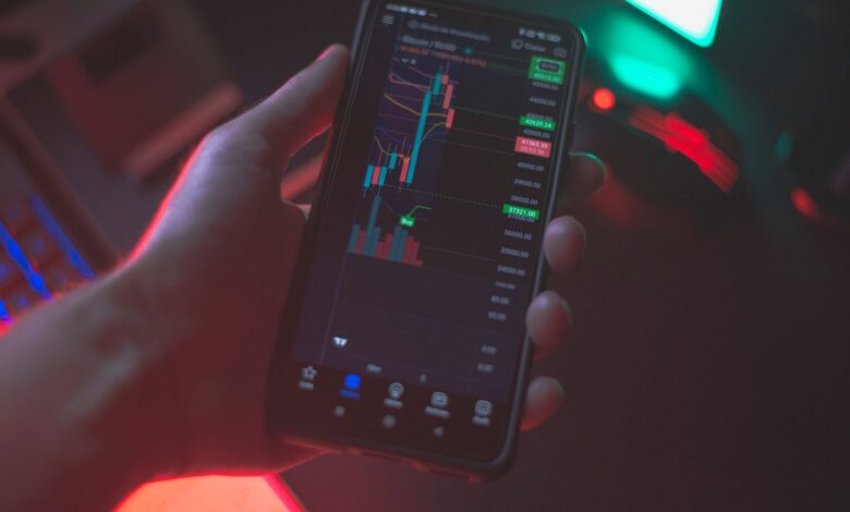 Person using a smartphone to trade cryptocurrency on a brokerage app