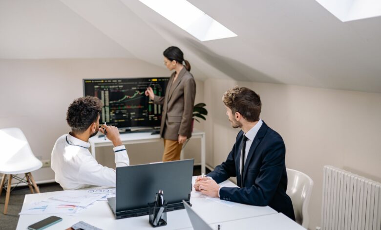 Business professionals in a formal finance meeting discussing investment strategy