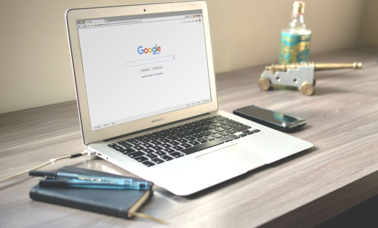 Open laptop with digital notebook app on screen in a modern workspace