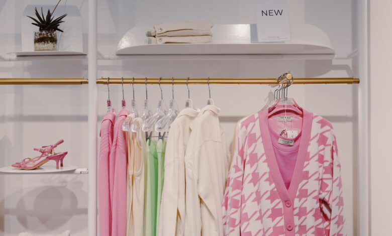 Interior of a modern fast-fashion clothing store with racks of garments