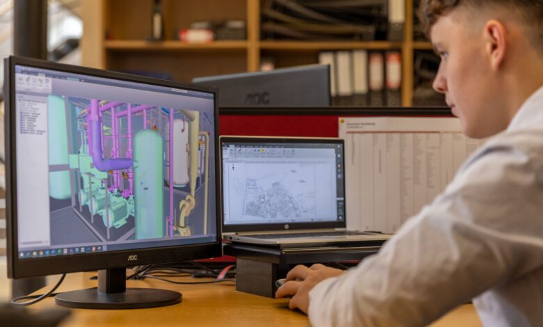 Designer working on a UI design tool on a desktop computer screen