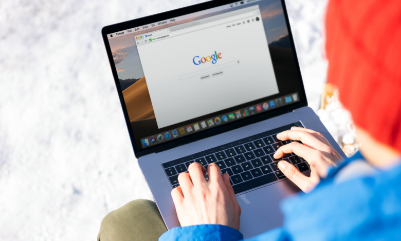 Person using a laptop to perform an AI-powered search query