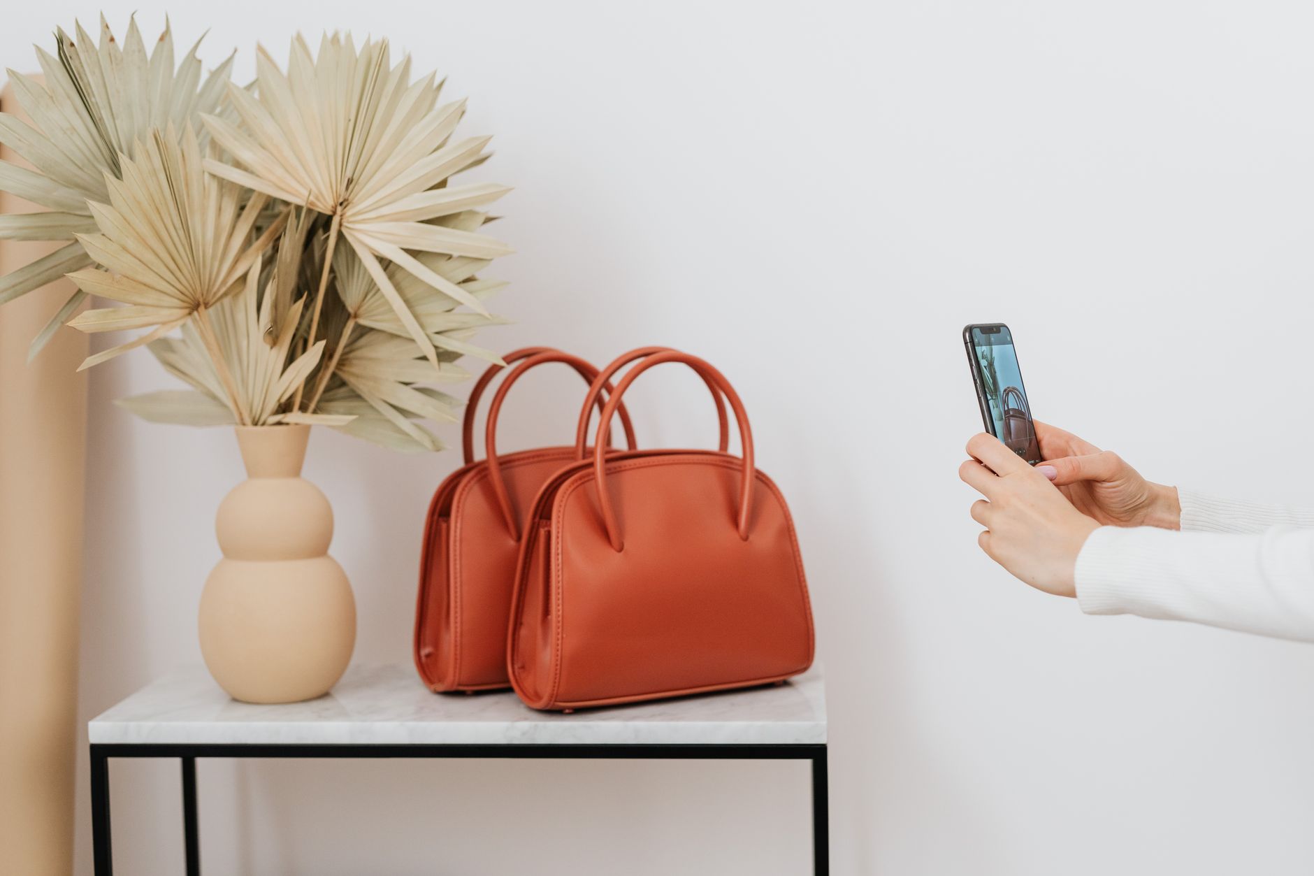 Close-up of an elegant leather luxury handbag on a neutral background