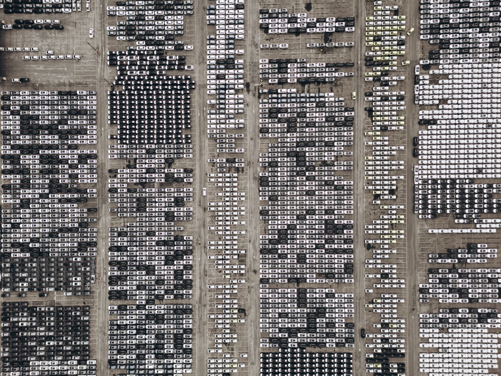 Workers on an automotive assembly line in a large manufacturing plant