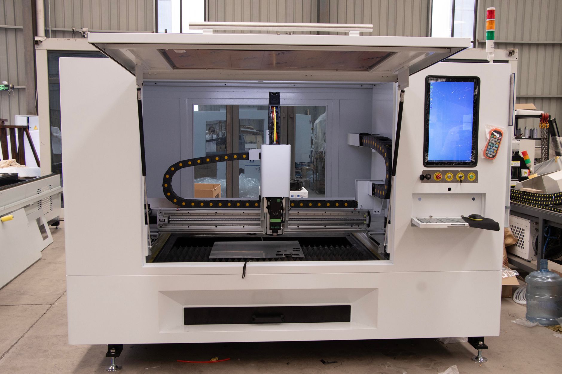 Large electronics manufacturing facility with industrial equipment and workers