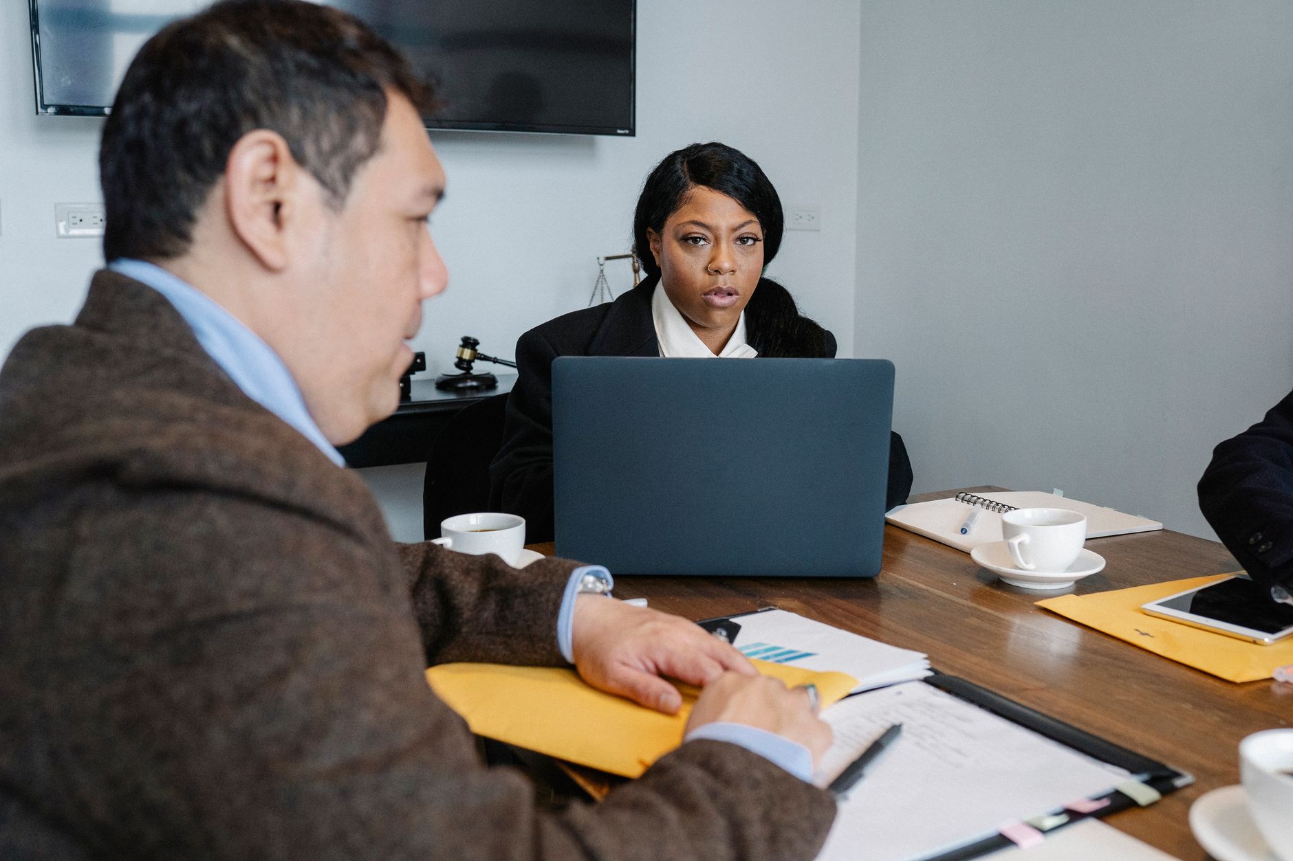 Business professionals reviewing growth strategy documents in a conference room
