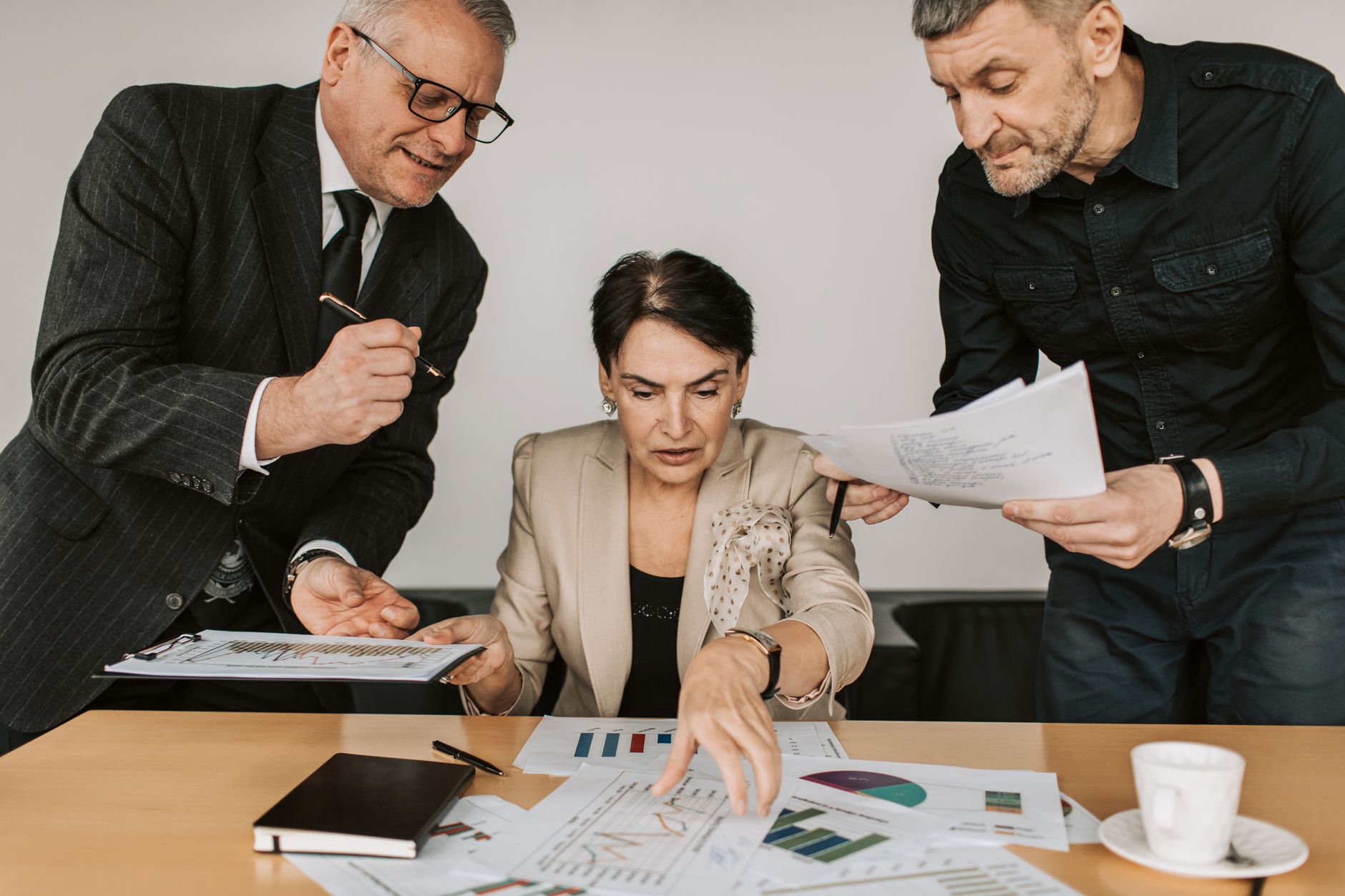 Business professionals in a boardroom discussing lending strategy and financial deals