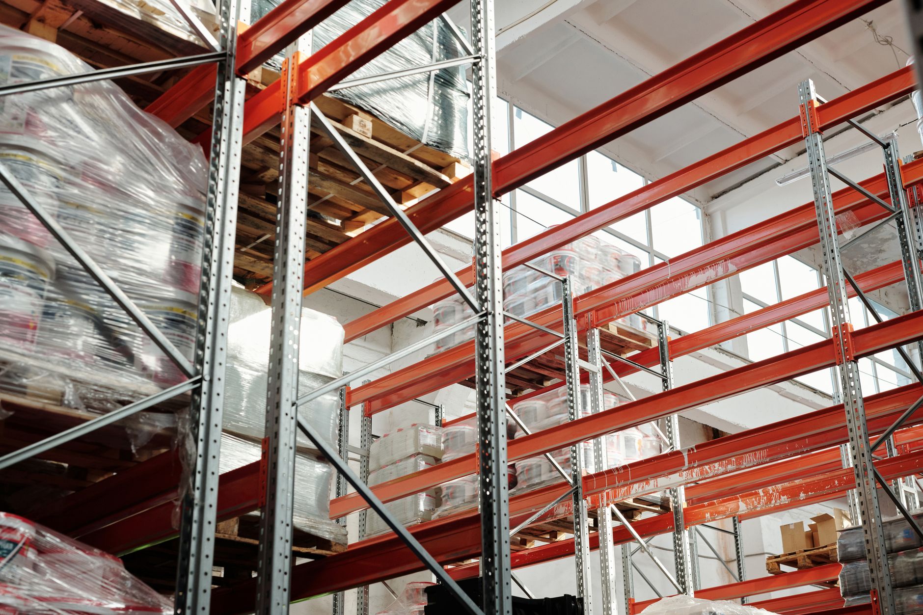 Workers inside a large warehouse managing freight and shipping operations