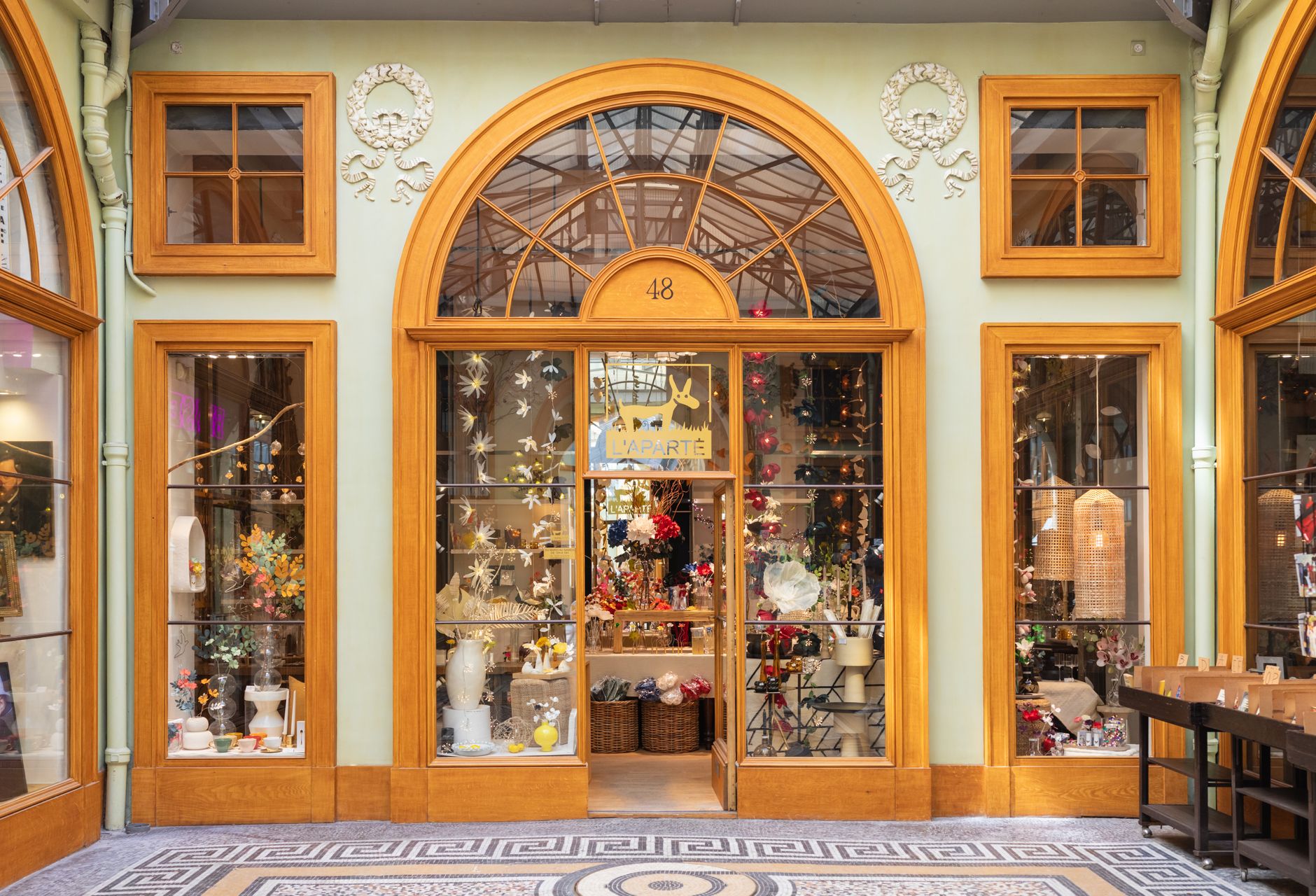 Upscale retail boutique interior with display cases and soft lighting