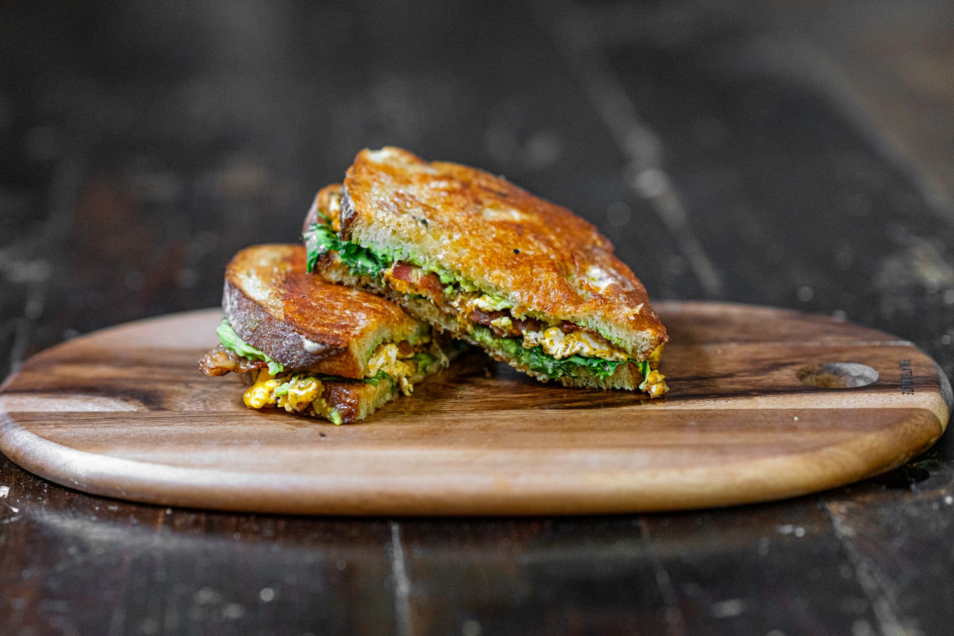 A fast food breakfast sandwich and coffee combo meal on a tray