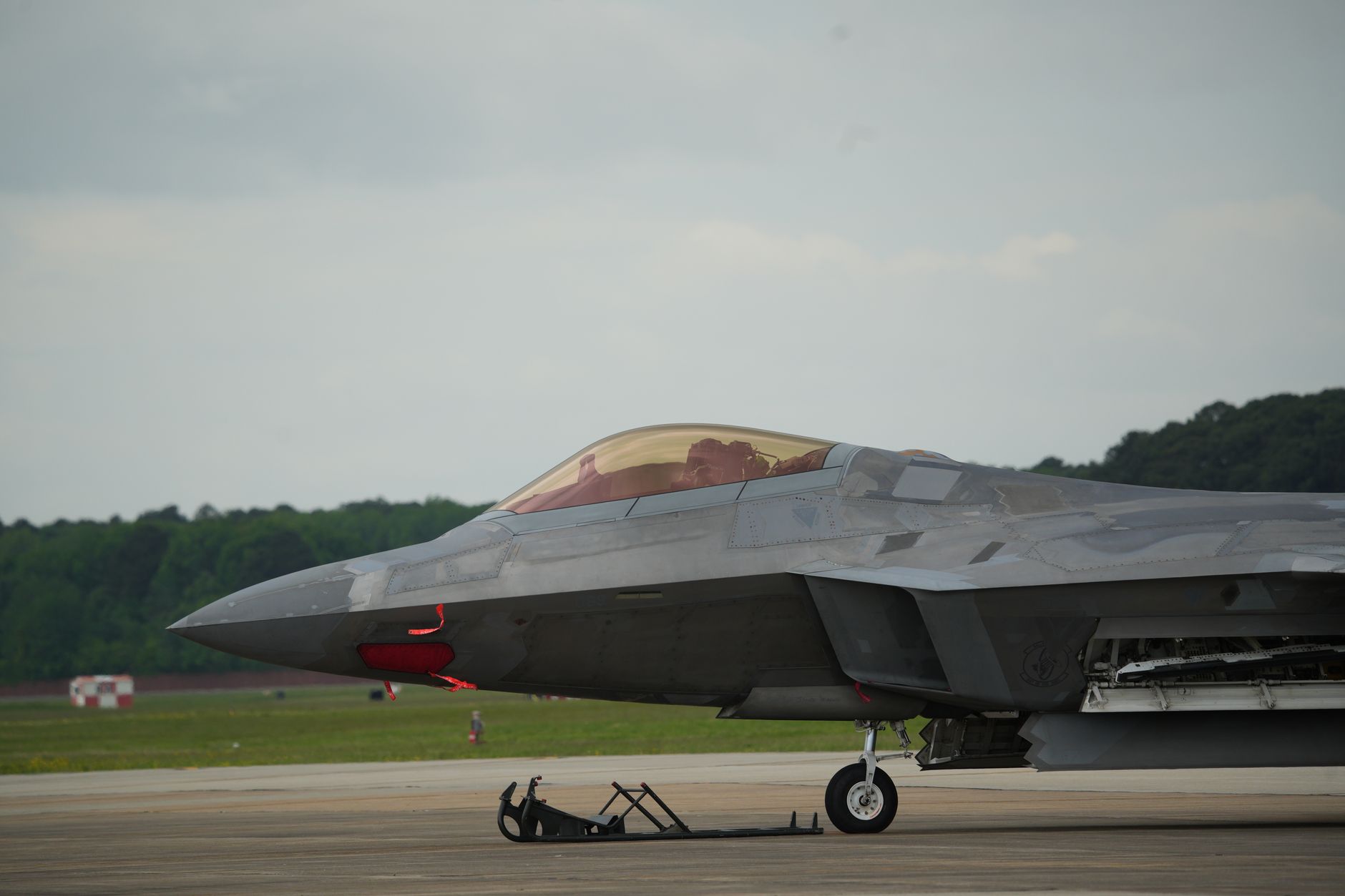 Military fighter jet on a runway at an airbase