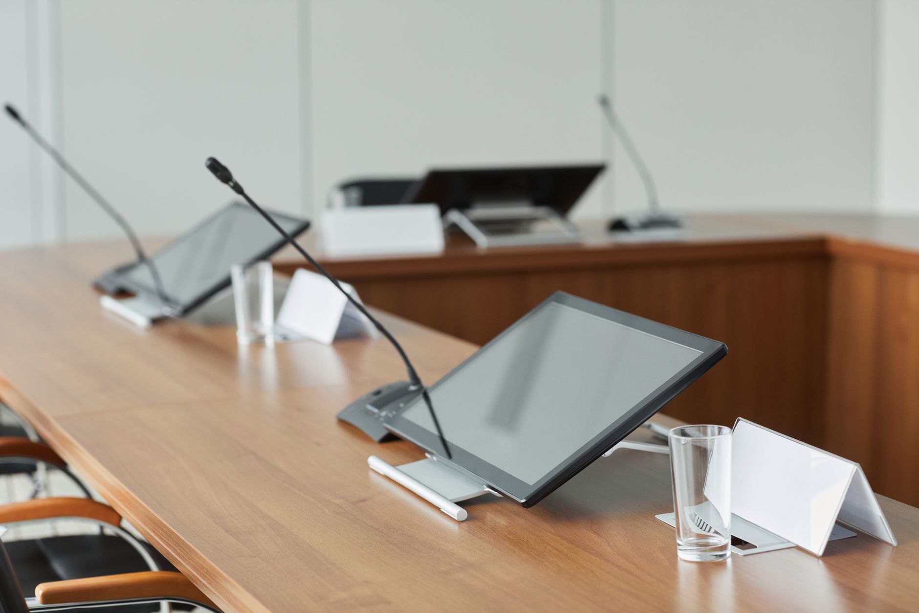 Corporate meeting room with executives reviewing technology strategy documents