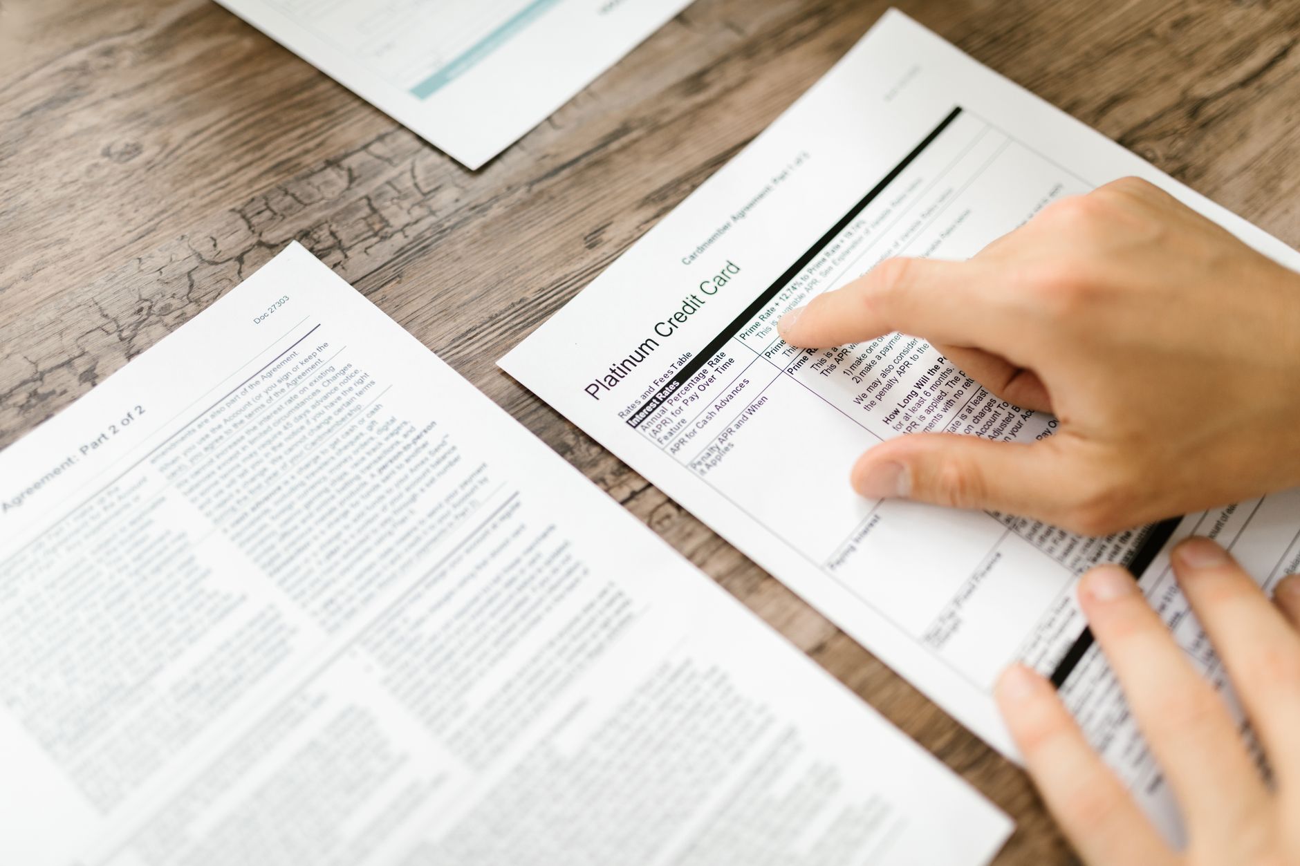 Financial documents and loan paperwork on a desk representing private credit transactions