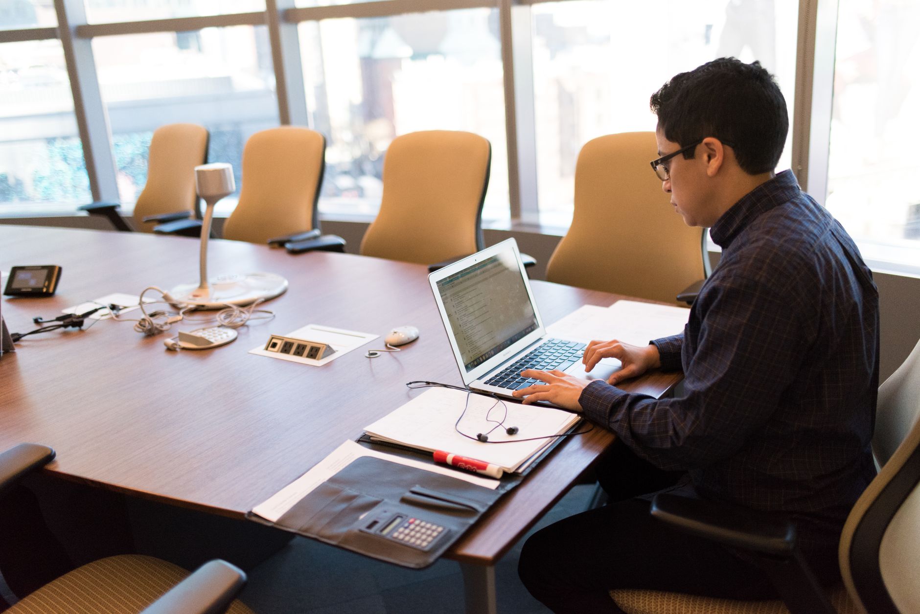 Business professionals reviewing technology solutions in a conference room