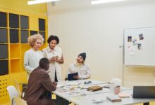 HR team discussing workforce management software at a conference table