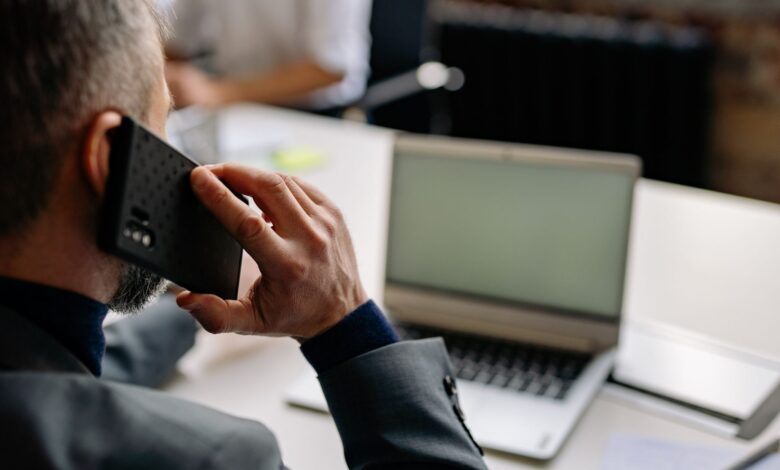 Modern enterprise office with communication technology screens and collaborative workspace