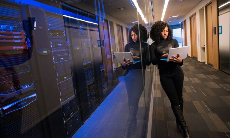 Rows of illuminated servers in a modern data center representing AI infrastructure