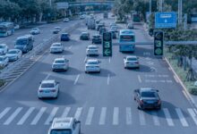 A self-driving electric vehicle navigating a city street without a driver