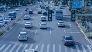 A self-driving electric vehicle navigating a city street without a driver