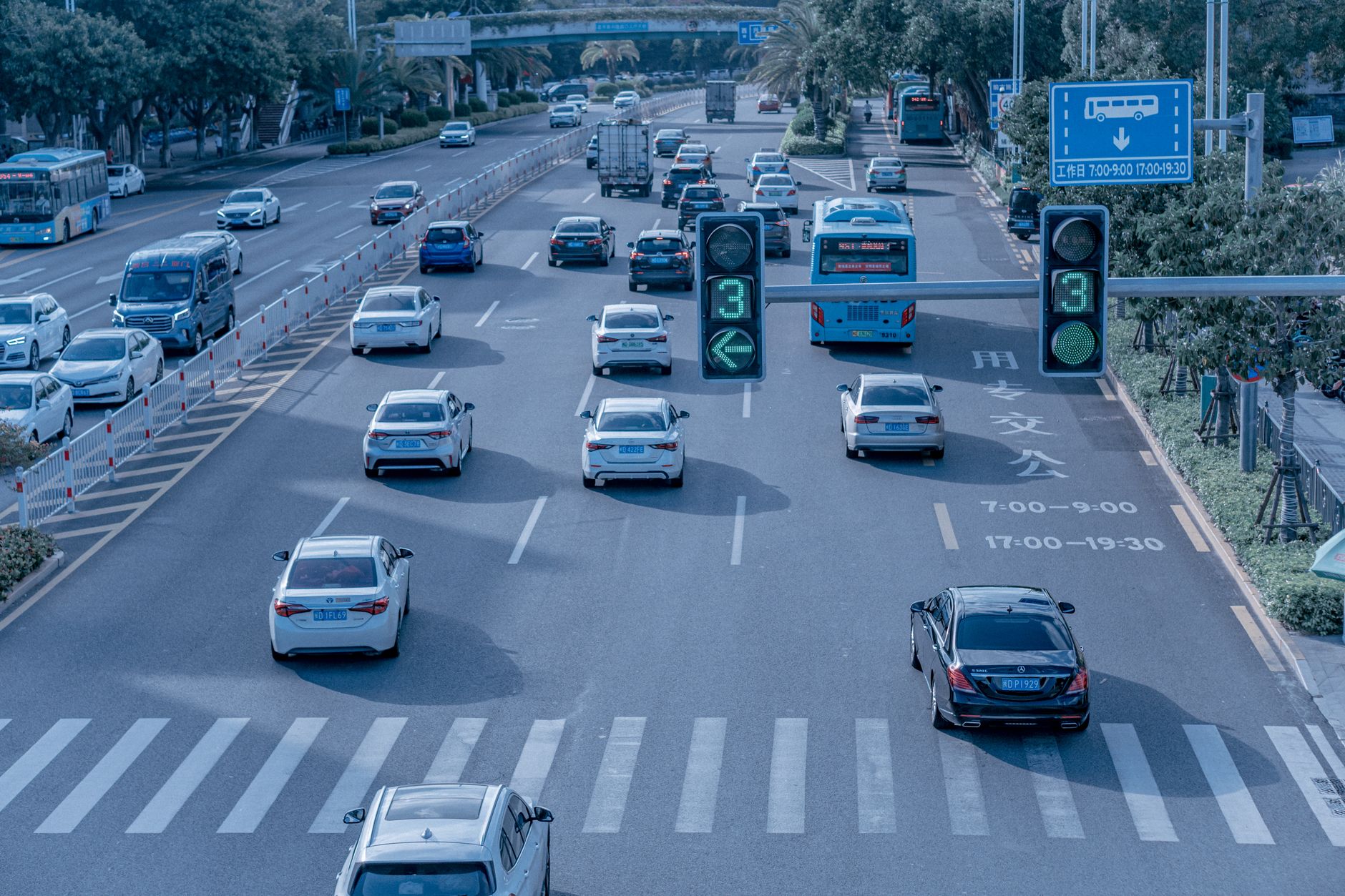 A self-driving electric vehicle navigating a city street without a driver
