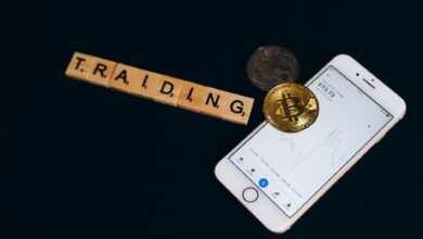 Person viewing a cryptocurrency trading app on a smartphone screen