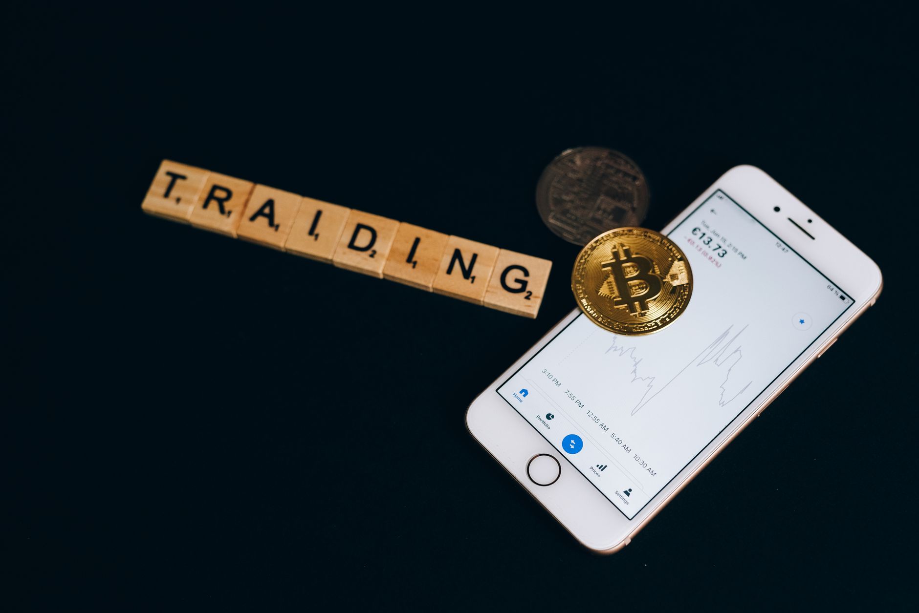 Person viewing a cryptocurrency trading app on a smartphone screen