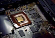 Close-up of a laptop processor chip on a circuit board representing ARM PC silicon competition
