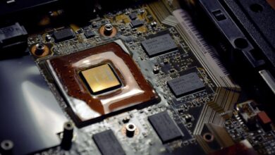 Close-up of a laptop processor chip on a circuit board representing ARM PC silicon competition