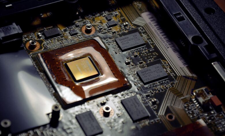 Close-up of a laptop processor chip on a circuit board representing ARM PC silicon competition