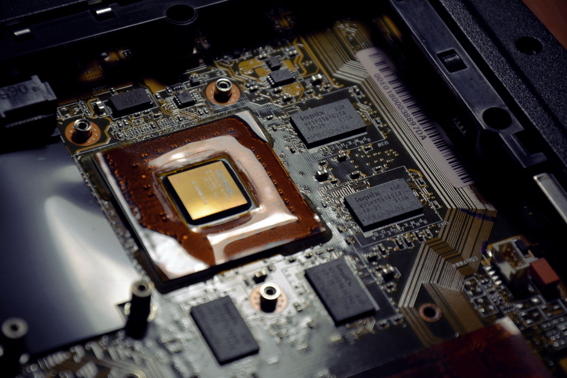 Close-up of a laptop processor chip on a circuit board representing ARM PC silicon competition