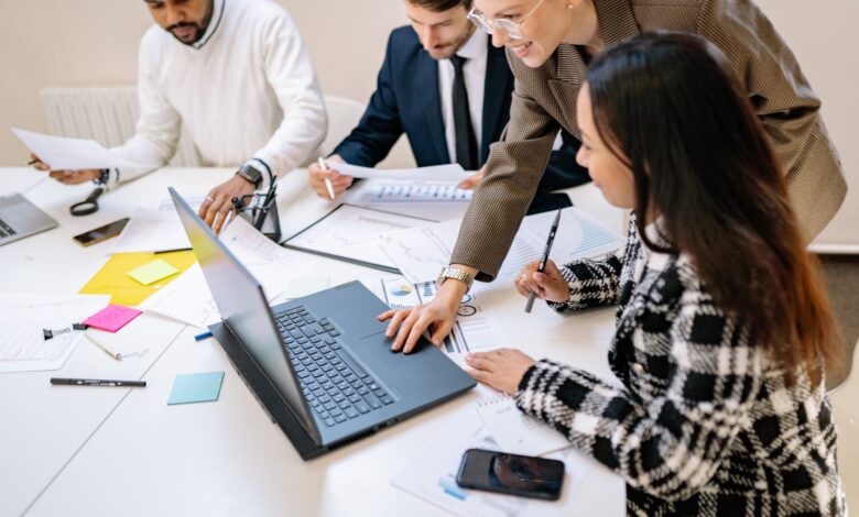 Team members collaborating in a modern open office workspace