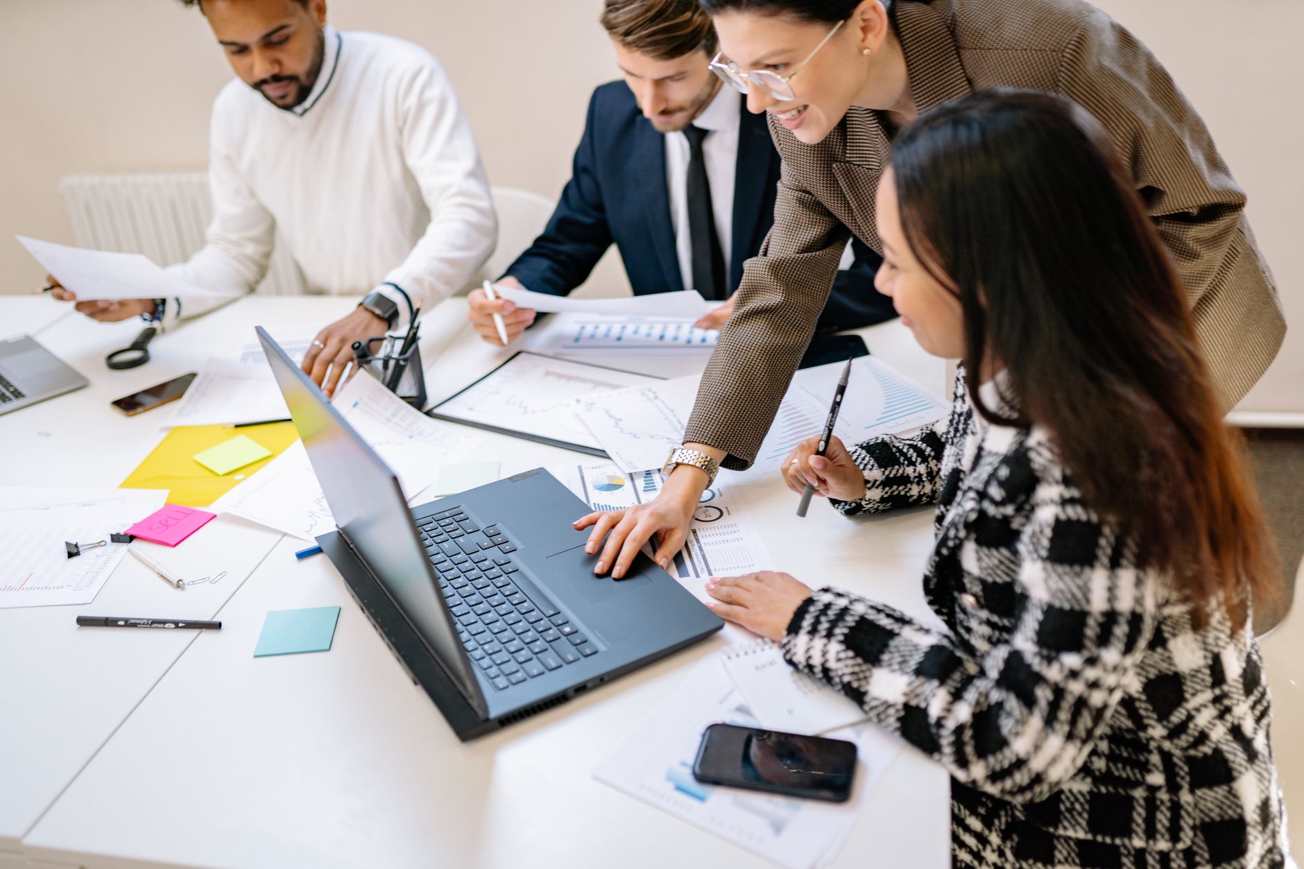 Team members collaborating in a modern open office workspace