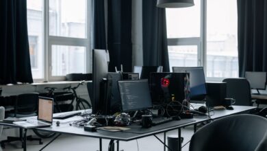 Business professionals working with enterprise software on computers in a modern office