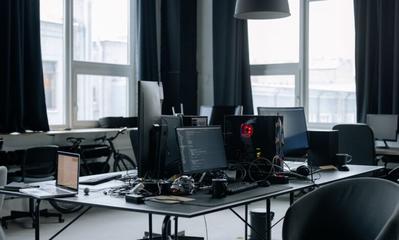Business professionals working with enterprise software on computers in a modern office