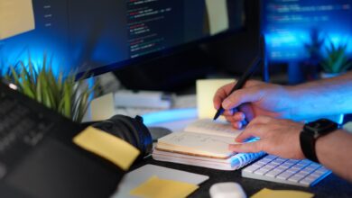 A developer taking notes on a laptop, representing personal knowledge management tools